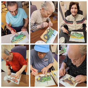 Residents engaging in 'Painting to Music' on the Memory Care Unit