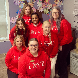 Some of our amazing team ready to walk in our matching LOVE sweaters