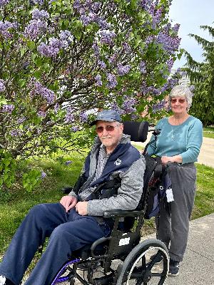 Barbara pushing John in preparation for the Walk for Alzheimer's.