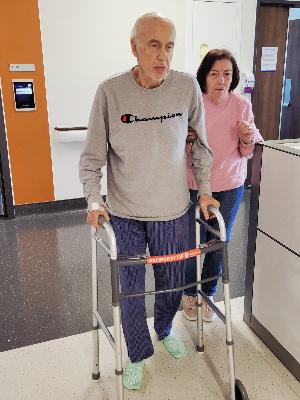 Dad trying to regain some strength earlier this year by walking during his hospital admission.
